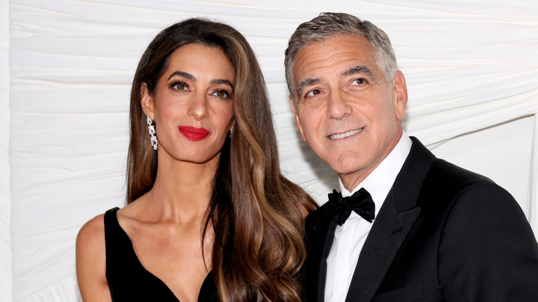 Amal Clooney and George Clooney on red carpet