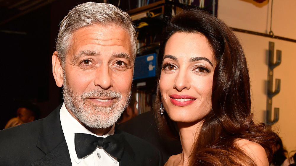 George and Amal Clooney at an award show