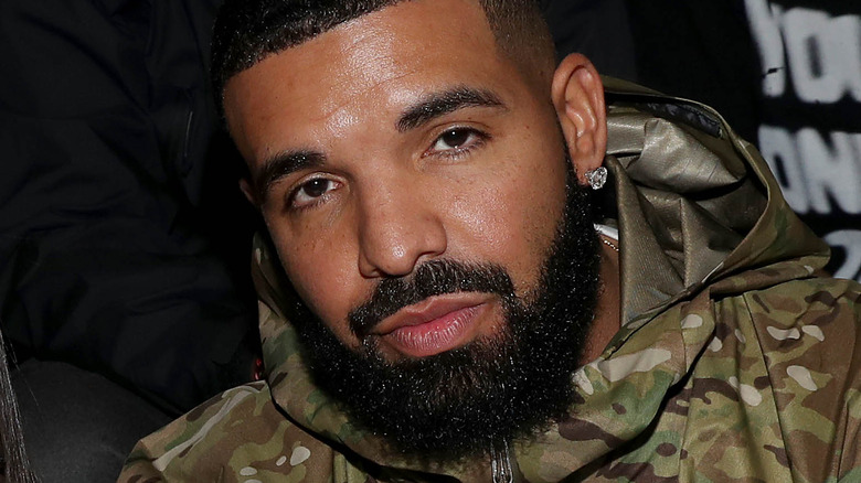 Drake with a serious expression