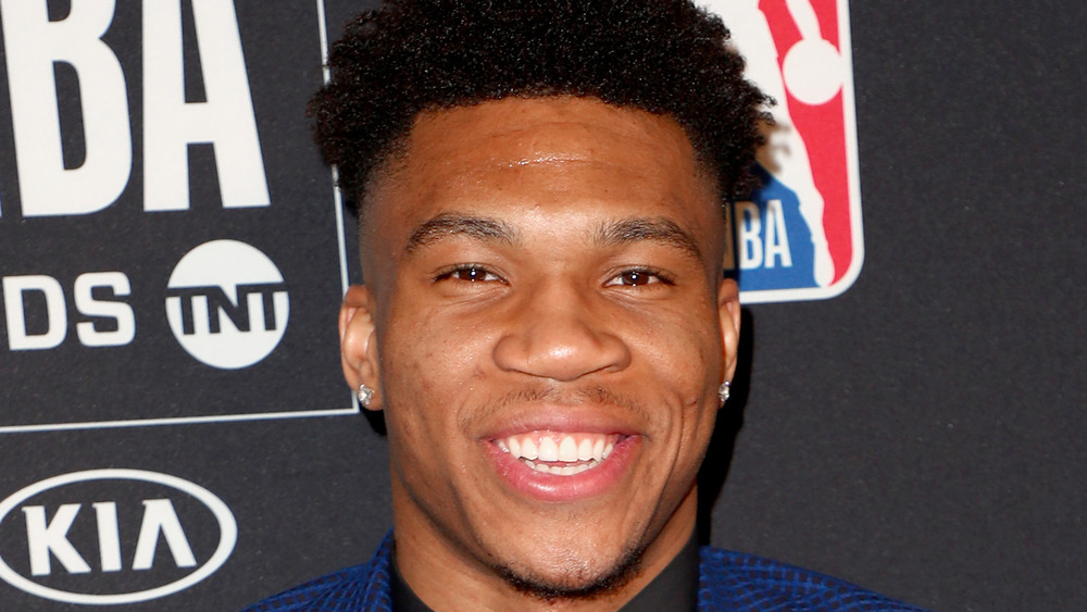 Giannis Antetokounmpo grins