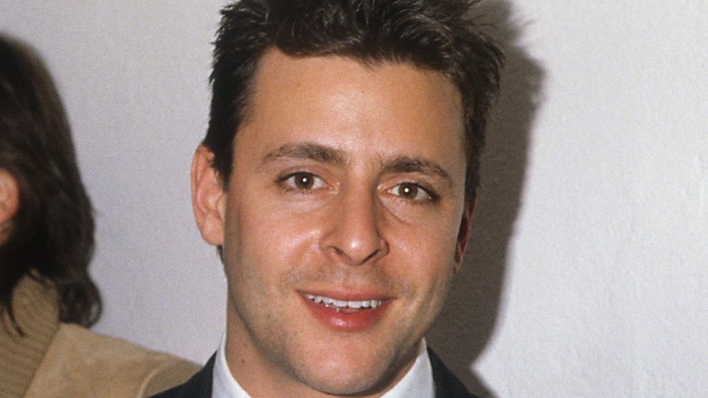 young Judd Nelson smiling