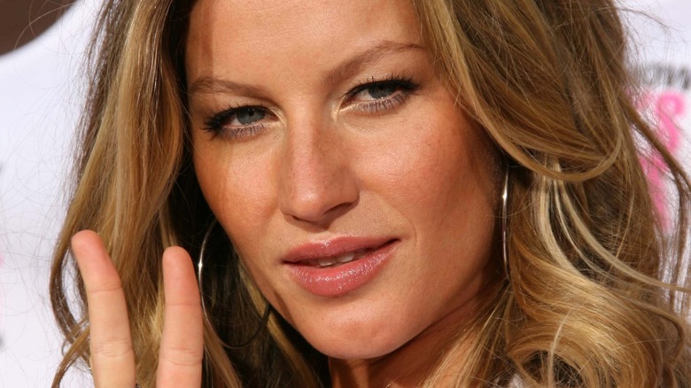 Gisele Bundchen hoop earrings peace sign 