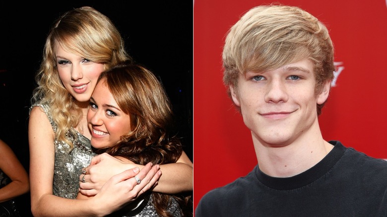 Taylor Swift and Miley Cyrus wearing silver sparkling dresses and Lucas Till wearing a black t-shirt