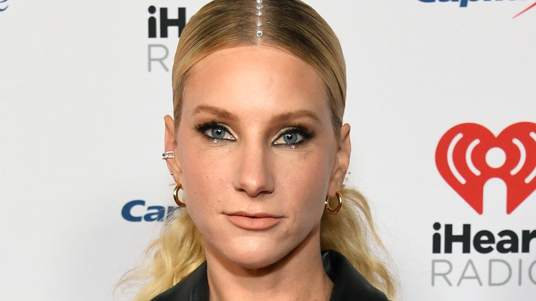 Heather Morris slicked blonde hair low ponytail sparkly eye makeup closed mouth