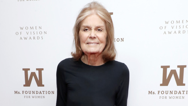Gloria Steinem posing on red carpet