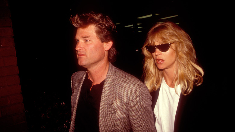 Kurt Russell and Goldie Hawn exiting Spago in 1991
