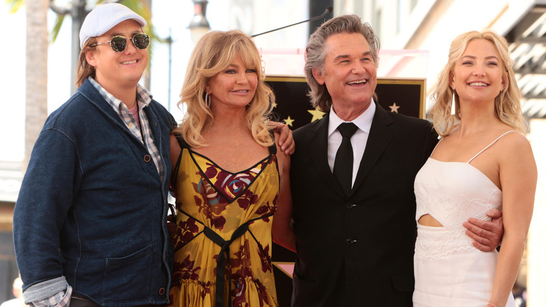 Boston Russell and Kate Hudson pose with Goldie Hawn and Kurt Russell at their star ceremony.