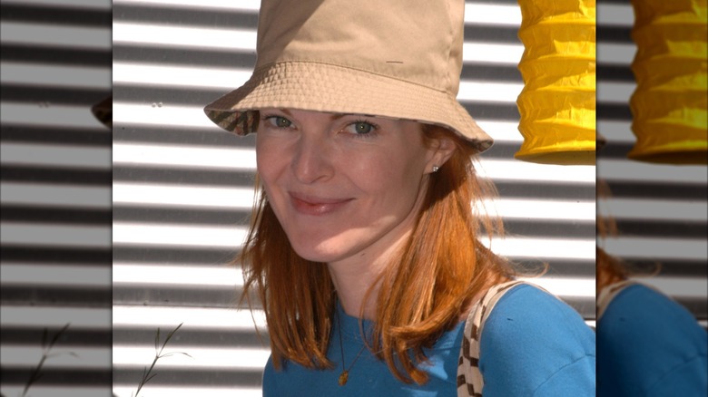 Marcia Cross smiling while wearing a hat, circa 2003
