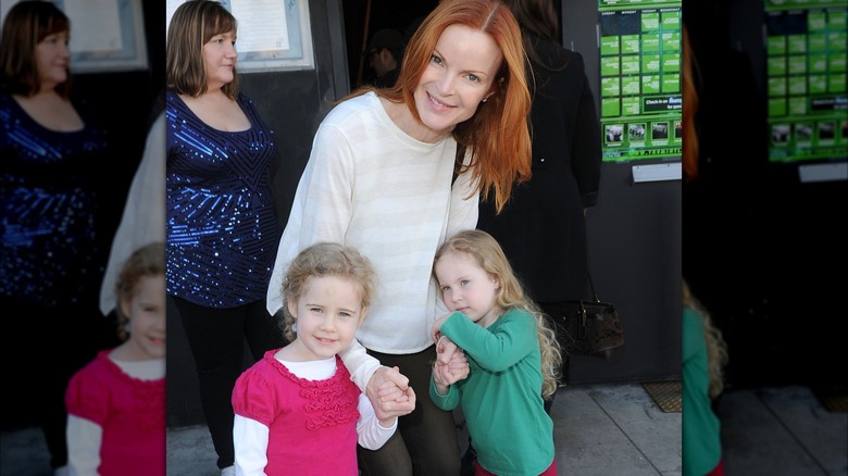 Marcia Cross and her twin daughters attending a 2011 benefit