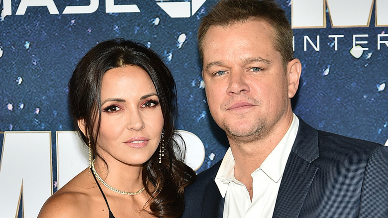 Matt Damon and Luciana Barroso posing for pictures