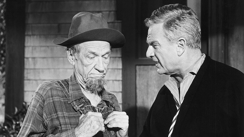 Hank Patterson as Fred Ziffel with Eddie Arnold as Oliver Wendell Douglas in a scene from "Green Acres"
