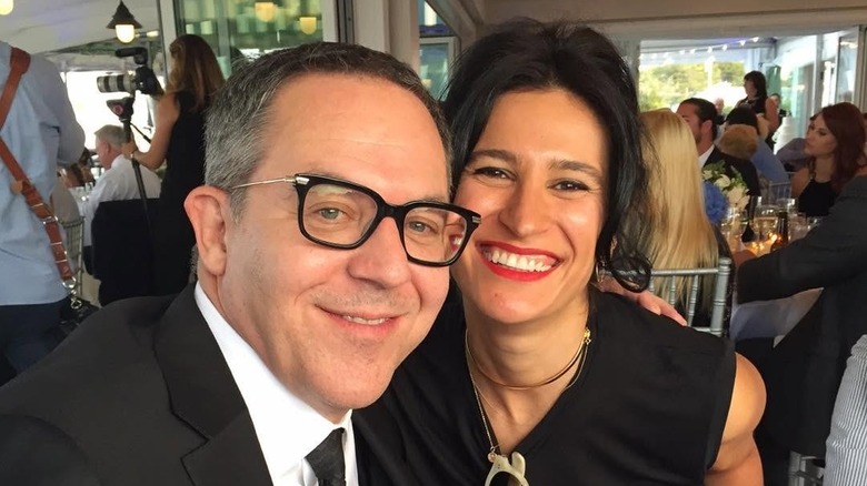 Greg Gutfeld poses with Elena Moussa at Rob O'Neill's wedding in 2017