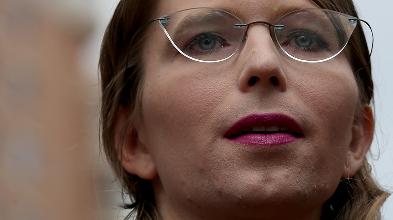 Chelsea Manning wears fuscia lipstick