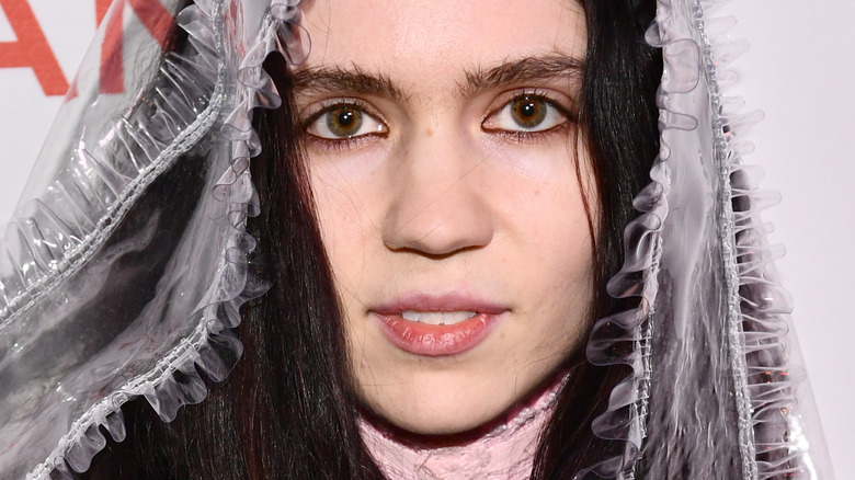 Grimes posing in 2018