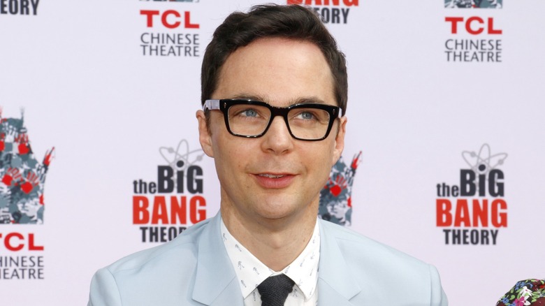 Jim Parsons smiles as he looks up in classic Sheldon Cooper fashion.