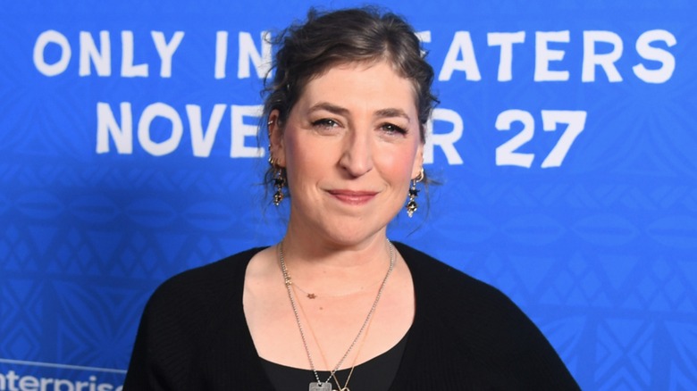 Mayim Bialik looks into the camera while making a face.