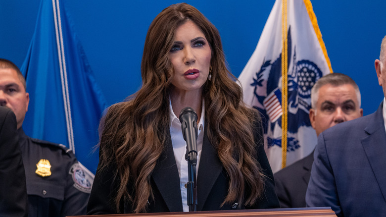Kristi Noem behind the podium at a news conference in New York