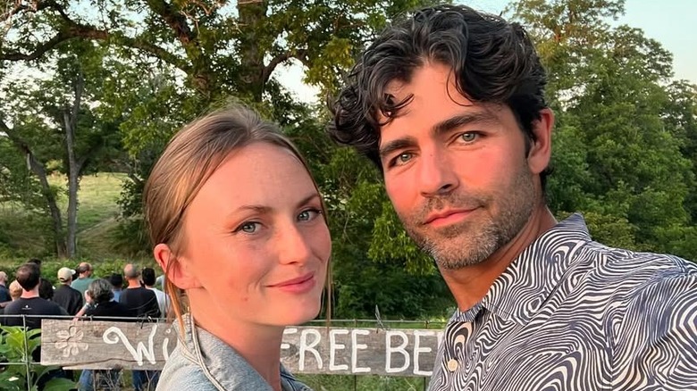 Jordan Grenier and Adrian Grenier taking a selfie with trees in the background.
