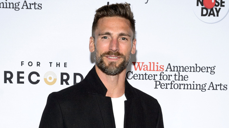 Andrew Walker wearing a black jacket