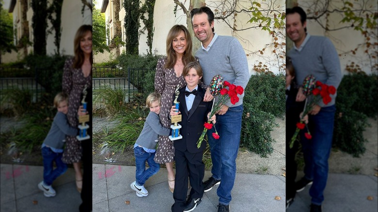 Nikki DeLoach, family posing outdoors