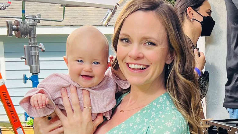 Rachel Boston with her daughter Grace on set