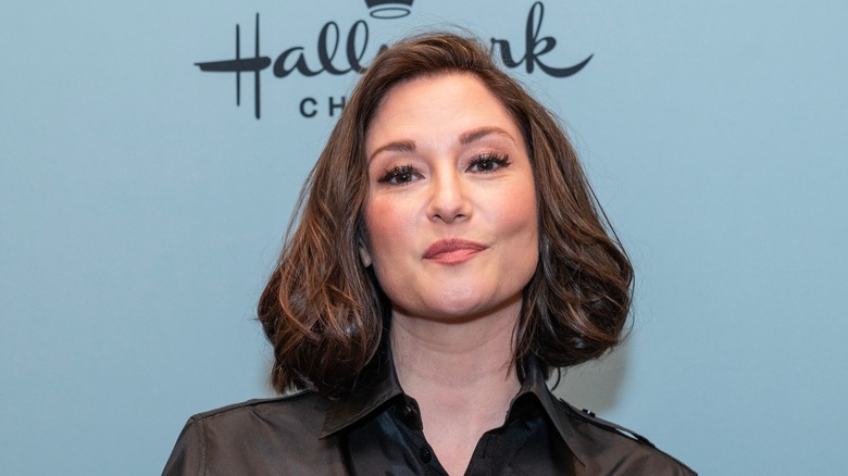 Chyler Leigh posing at a Hallmark event
