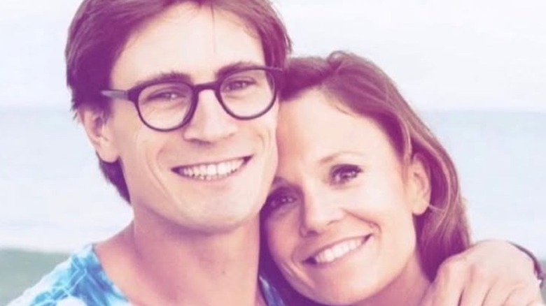Rachel Boston and her husband Tolya Ashe posing for a photo