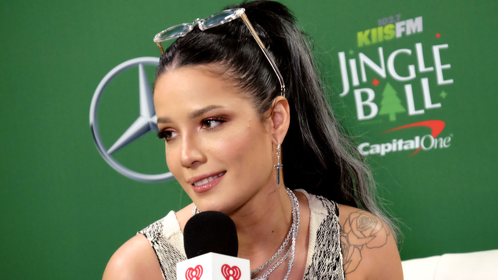 Halsey smiling with microphone