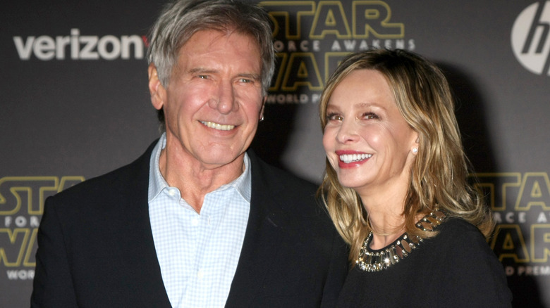 Harrison Ford poses on the red carpet with Calista Flockhart