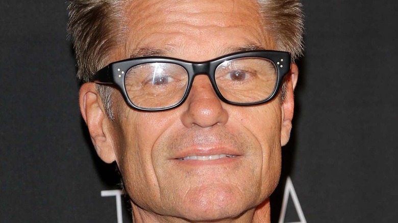 Harry Hamlin smiling on red carpet