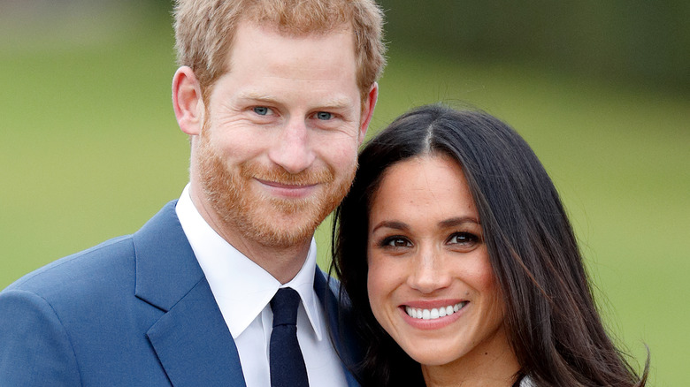 Prince Harry and Meghan Markle posing for engagement photo