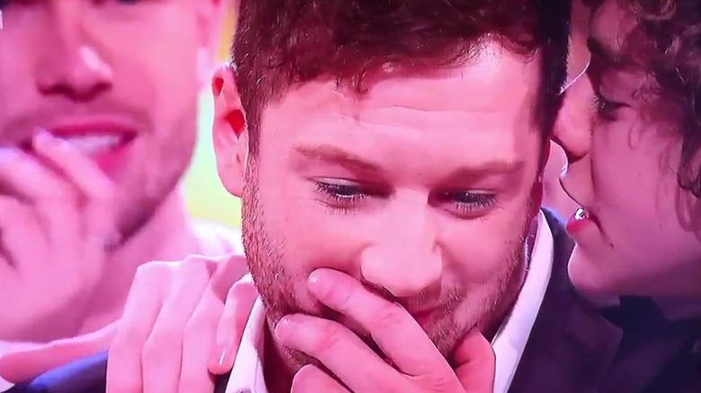 Harry Styles whispering in Matt Cardle's ear