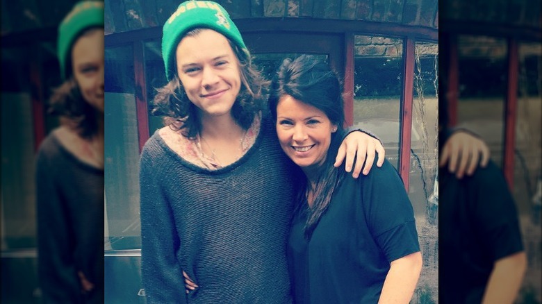 Harry Styles with arm around mom Anne Twist