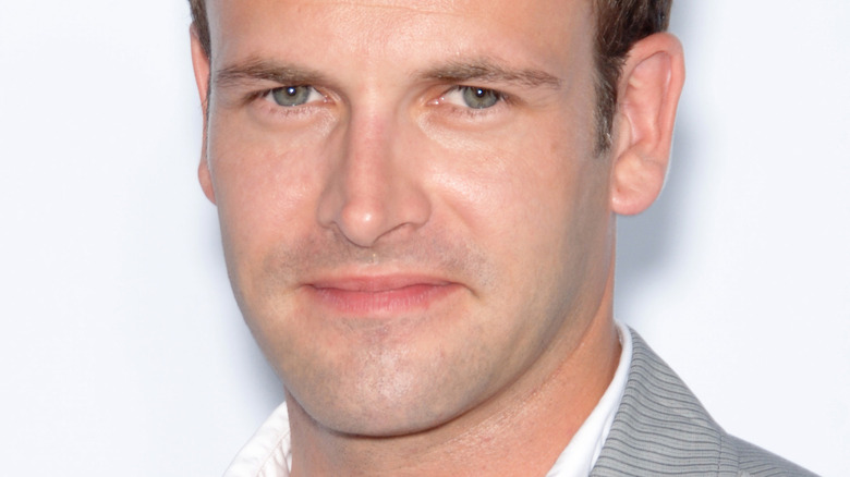 Jonny Lee Miller smiling on the red carpet