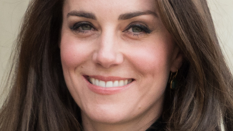 Kate Middleton looking at camera with wide smile