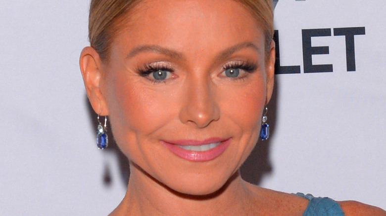 Kelly Ripa wearing blue earrings