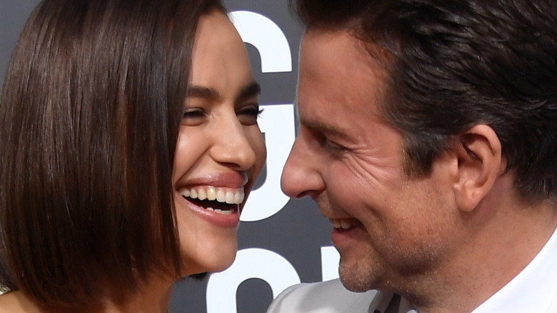 Irina Shay and Bradley Cooper laughing