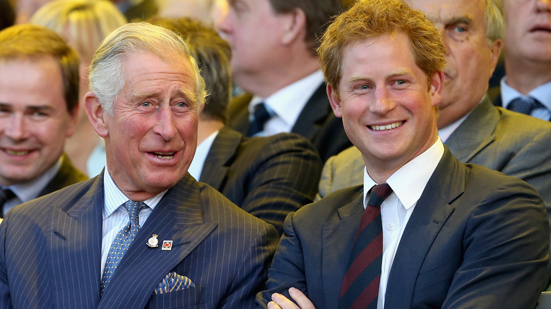 Prince Charles and Prince Harry smiling