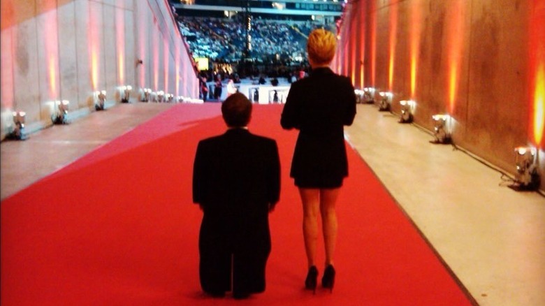 Donny Davis and Hayden Panettiere from behind standing together on a red carpet