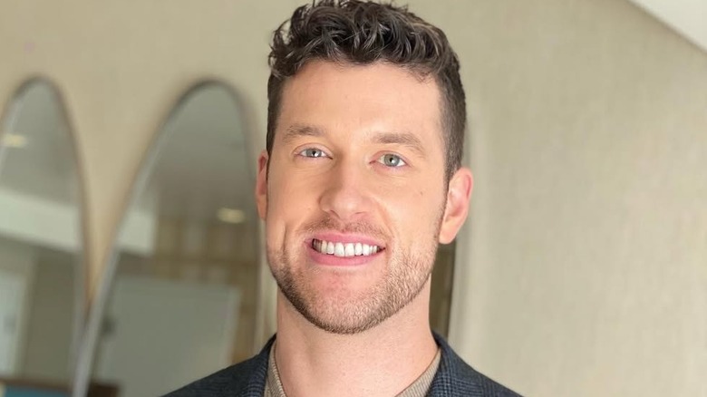 Clayton Echard posing for Instagram snap at home