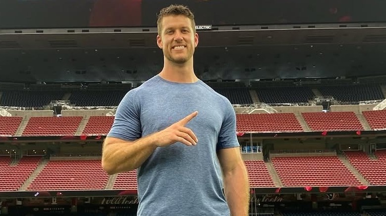 Clayton Echard posing on football field