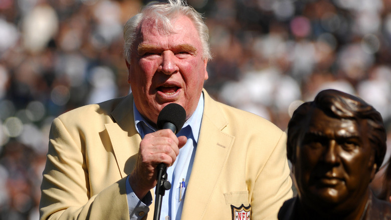 John Madden speaking on the field