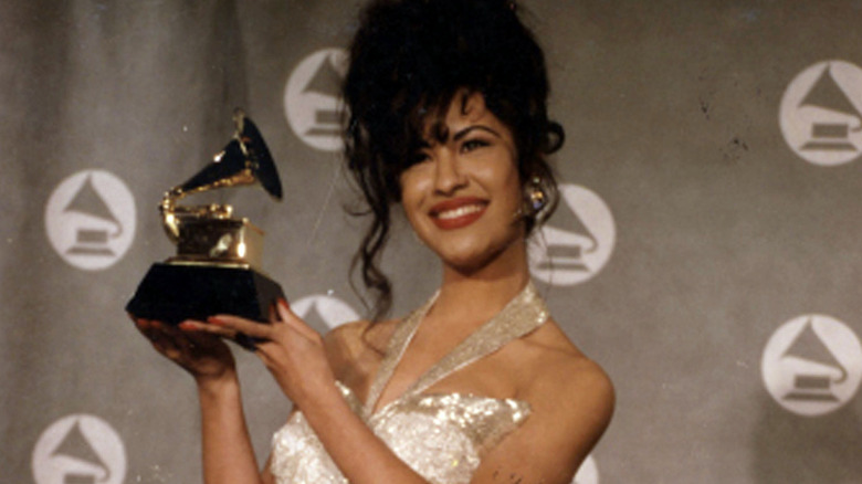 Selena poses with her Grammy award for Best Mexican/American Album