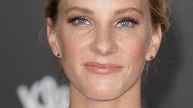 Heather Morris with slight smile on red carpet 