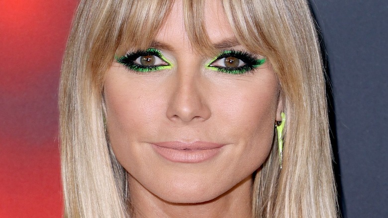 Heidi Klum with green eyeliner, posing