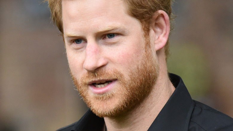  Prince Harry looking to the side with mouth slightly open