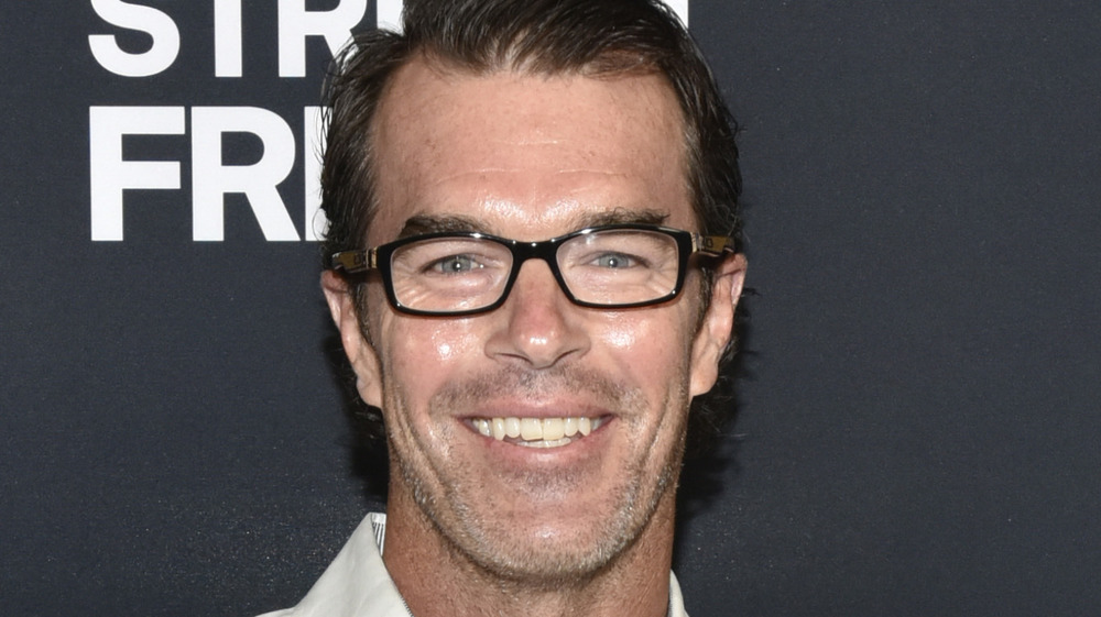 Ryan Sutter smiling on the red carpet