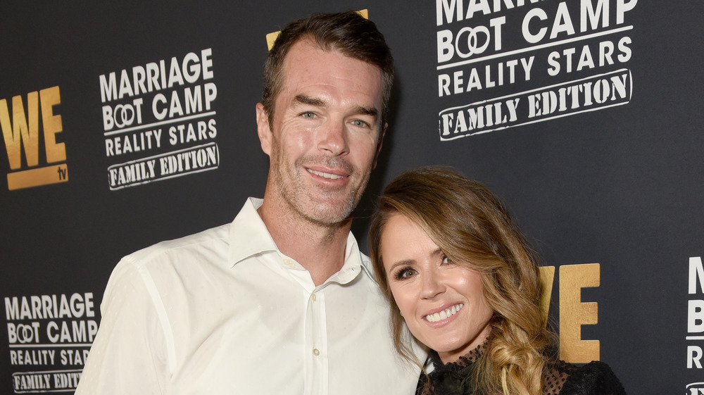 Ryan Sutter and Trista Sutter posing together on the red carpet