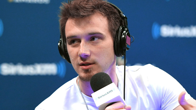 Morgan Wallen wearing headphones