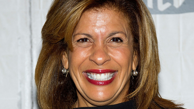 Hoda Kotb with wide smile and red lipstick